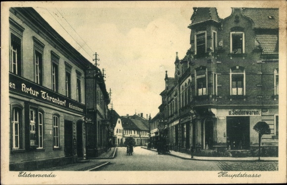 Postcard Elsterwerda in Brandenburg, main street, grocery store Artur Thrandorf, shops