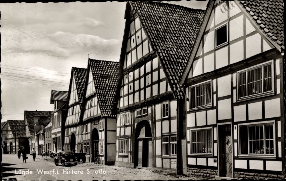 Postcard Lügde in the Weserbergland, Hintere Straße, half-timbered houses, car, bicycle