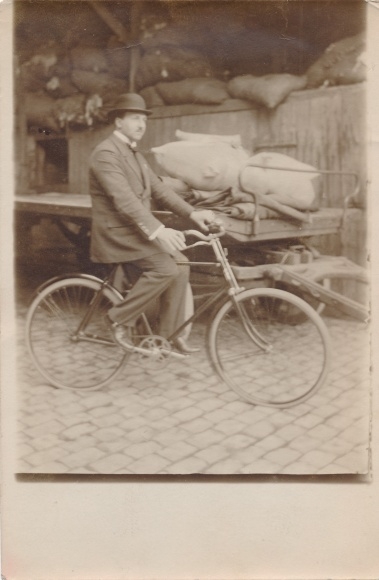 Photo Postcard bicycle, man, suit, hat, sacks of flour