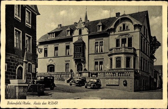 PC Birkenfeld in Rhineland-Palatinate, lot at the house of the NSDAP, cars, fountain, pharmacy