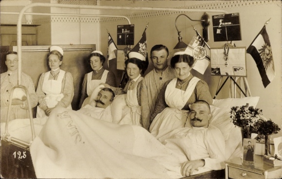 Photo Postcard nurses at the patient's bed, flags