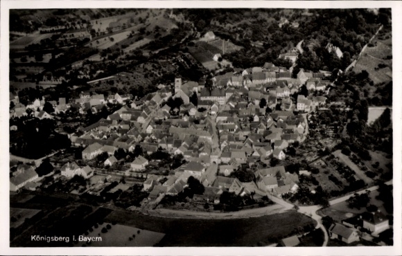 Postcard Königsberg in Bavaria Lower Franconia, aerial view of Königsberg, many houses, green landscape