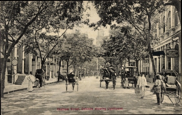 PC Colombo Ceylon Sri Lanka, street scene with lighthouse in the background, rickshaws