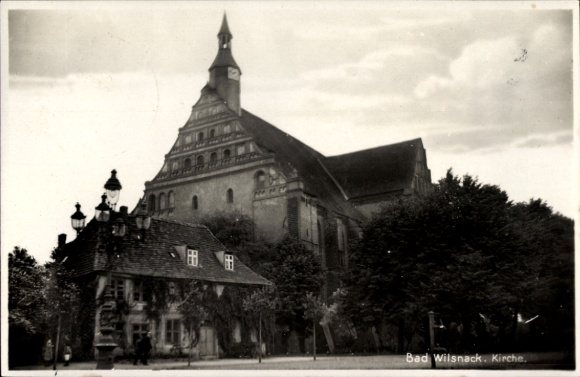 Postcard Bad Wilsnack in der Prignitz, church, historic building, trees, house in the foreground, clouds