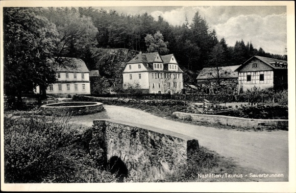 Postcard Nastätten in the Rhein Lahn district, acidulous fountain, bridge, street section