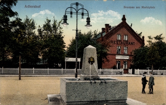 Postcard Berlin Treptow Adlershof, fountain at the market square, cooperative inn, watchmaker Helbig