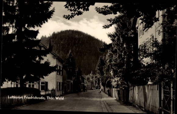 Postcard Friedrichroda in the Thuringian Forest, climatic health resort Friedrichroda, trees, houses, street, mountain in the background