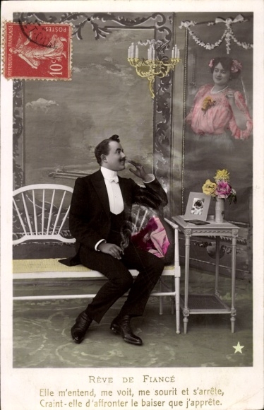 Postcard Reve De Fiancé, man in a suit sitting smoking on a bench, portrait of a woman on the wall