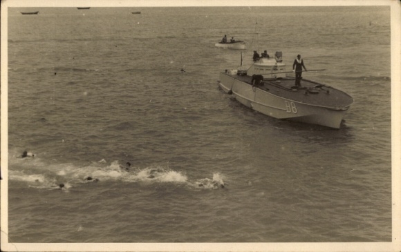 Postcard swimmers, escort boat