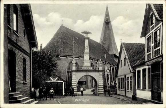 Postcard Estebrügge Jork in the Stade district, street section, gate with war memorial, church