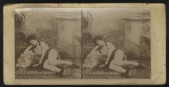 Stereo photo, erotic scene, scantily clad young woman lying on a carpet