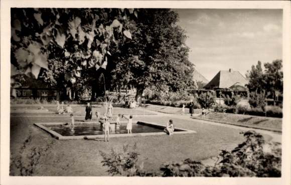 Postcard Oldenburg in Holstein, children's playground, fountain, trees, houses