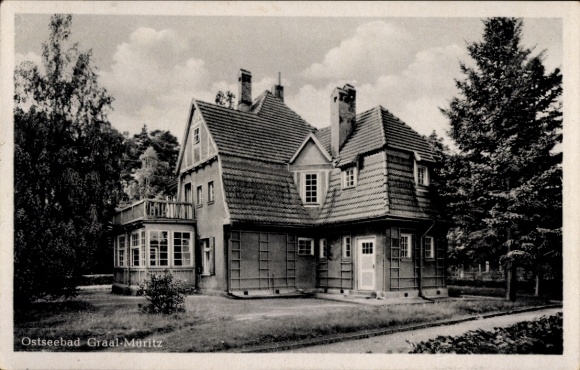 Postcard Ostseebad Müritz Graal-Müritz, house in the Baltic Sea resort green surroundings, clouds in the sky