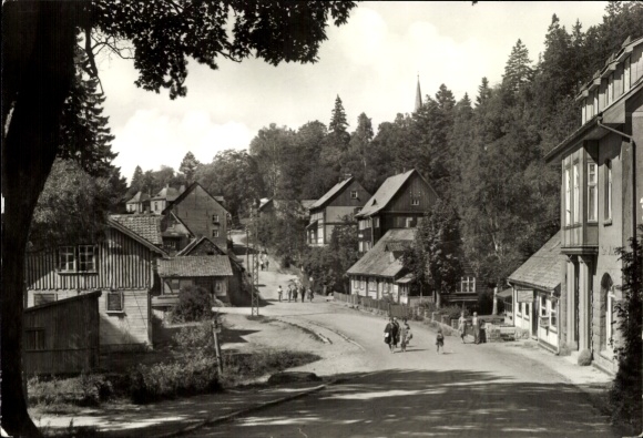 Postcard Schierke Wernigerode in the Harz Mountains, beautiful street with typical Harz half-timbered houses, trees,...