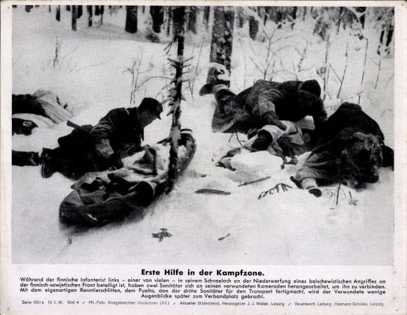 Photo First aid in the combat zone, Finnish infantryman is brought to the first aid station, WWII