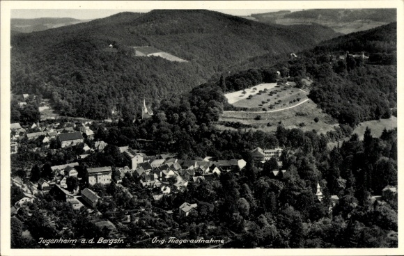 Ak Jugendheim an der Bergstraße, Luftaufnahme von Jugendheim, hügelige Landschaft, Gebäude, Bäume