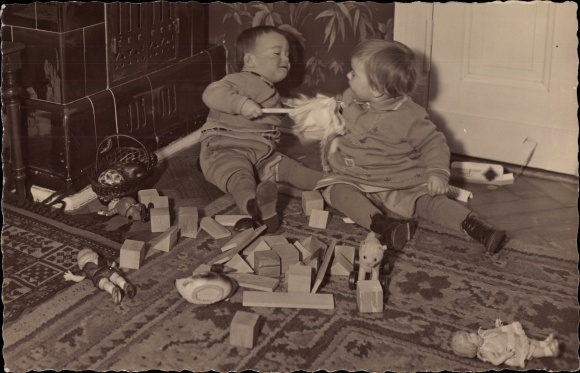 Photo Postcard Two small children with toys, building blocks, dolls