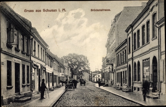 Postcard Schwaan in Mecklenburg, Brückenstraße, shops
