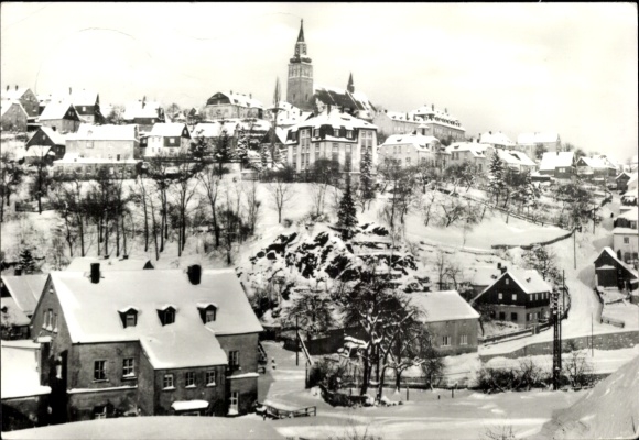Postcard Schneeberg in the Ore Mountains, snow-covered town view, church in winter, old houses, snow-covered...