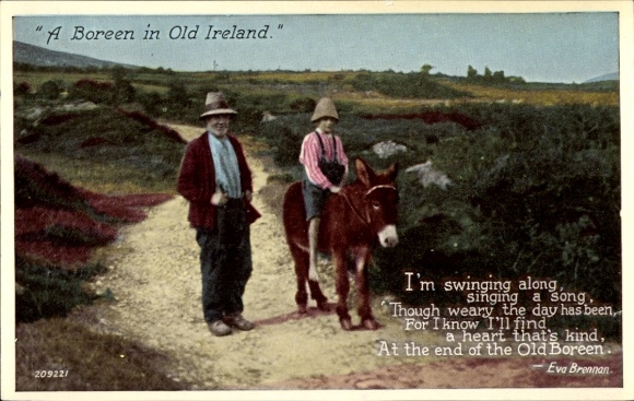 Acadia Abbeyleix Co. Laois Ireland, a man and child walk along a dirt road. A donkey is with them.