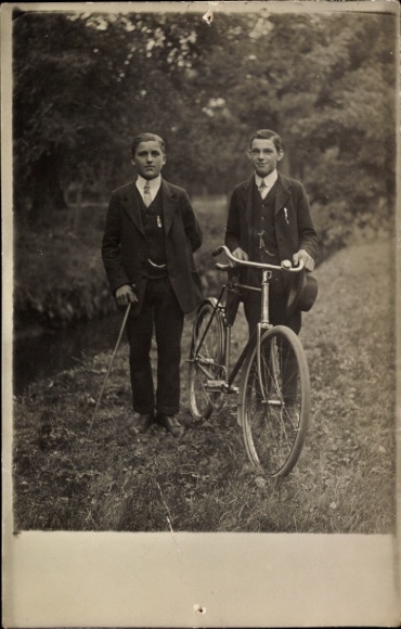 Photo Postcard Two men with bicycle, portrait
