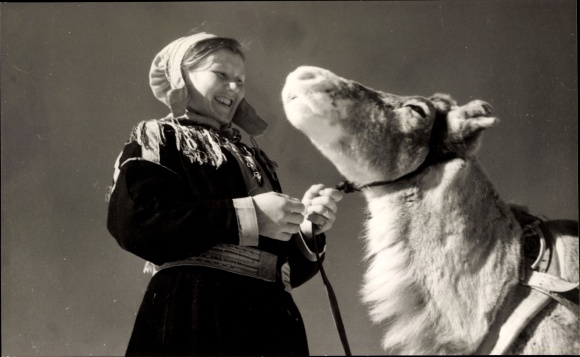 Postcard woman in Finnish national costumes, animal