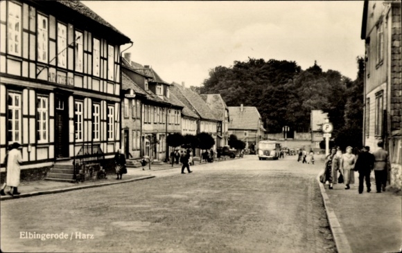 Postcard Elbingerode Oberharz am Brocken, street in Elbingerode, half-timbered houses, vehicles on the street...