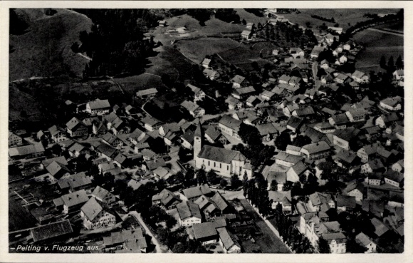 Postcard Peiting in Upper Bavaria, aerial view of church in the foreground, typical residential buildings