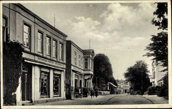Ansichtkaart Süderbrarup Sleeswijk-Holstein, straatdeel, horlogemaker Johannes Möller, zaak Julius Dechow