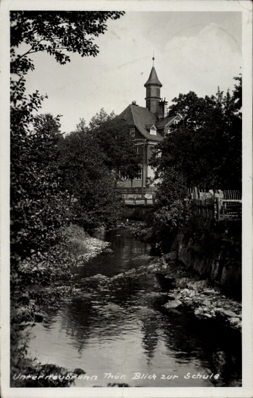 Postcard Eisfeld in Thuringia, view of a building, river in the foreground, surrounding trees, old poles...