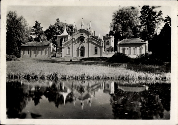 Ak Wörlitz in Anhalt, Wörlitz Park, Gotisch Huis, parklandschap, waterreflectie, architect