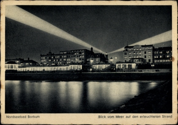 Postcard North Sea resort Borkum in East Frisia, North Sea resort illuminated beach, view from the sea, night view