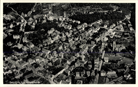 Postcard Betzdorf an der Sieg, aerial view of many houses, church visible