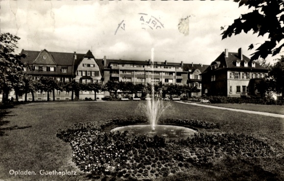Postcard Opladen Leverkusen in the Rhineland, The picture shows a fountain with houses lying around it...