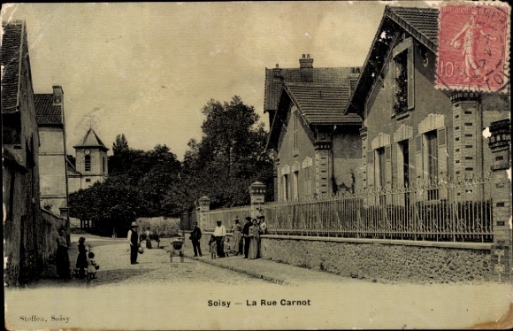 Ak Soisy sur Seine Essonne,  La Rue Carnot, Menschen, Häuser, Straßenansicht