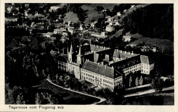Postcard Tegernsee in Upper Bavaria, aerial view of the monastery building, landscape with mountains