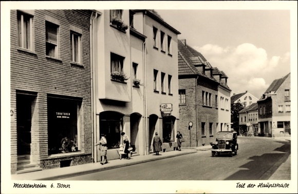 PC Meckenheim in the Rhein Sieg district, part of the main street, tractors Heinr. Brown Shoe Store Car