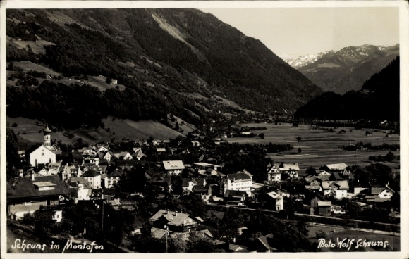 Postcard Schruns in Vorarlberg, Schruns in Montafon, mountain landscape, houses, church, photo by Wolf Schr