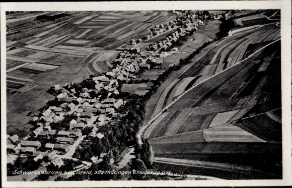 Postcard Schwarzenbrunn Sachsenbrunn in Thuringia, aerial photograph, view of the village and surroundings