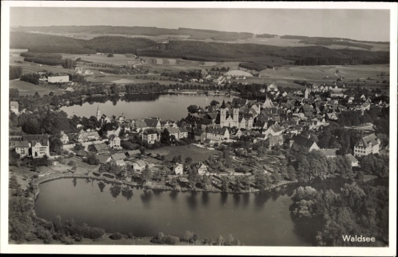 Postcard Waldsee in the Palatinate, aerial view of lake landscape, houses, trees