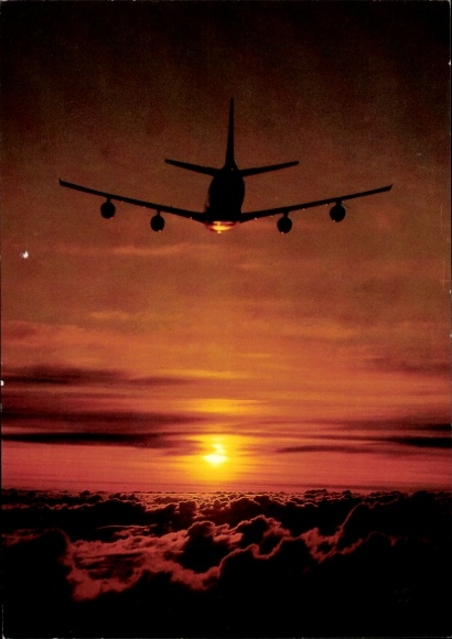Postcard Lufthansa passenger plane in flight above the clouds, sunset