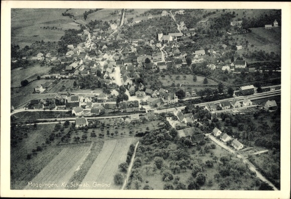 Postcard Mögglingen in the Ostalbkreis, aerial view of numerous houses, fields, trees