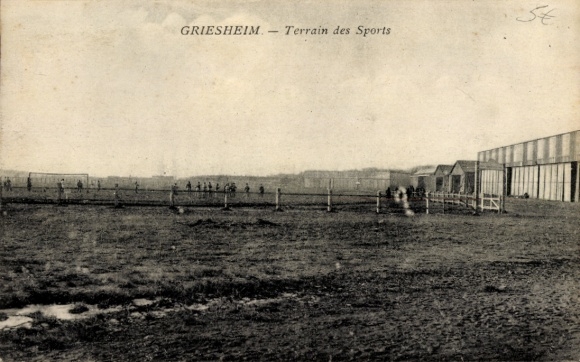 Postcard Griesheim near Darmstadt, sports field, football field, people playing, buildings in the background