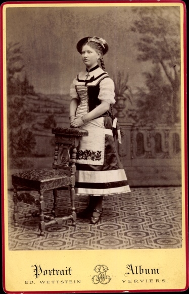 Cabinet photograph of woman in traditional Walloon costume, portrait