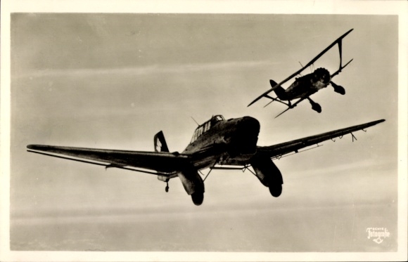 Postcard German Air Force, dive bomber Junkers Ju 87 is attacked by a fighter