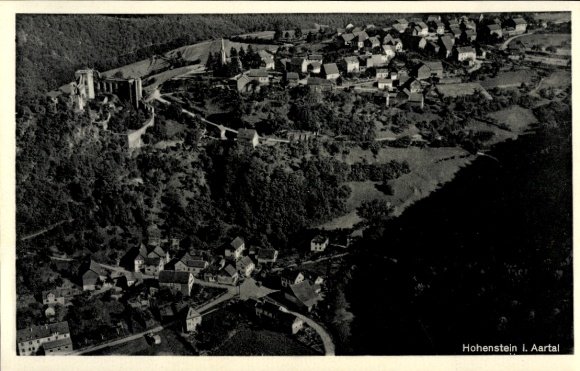 Postcard Hohenstein im Taunus, aerial view of Hohenstein Castle, surrounding houses, forest areas