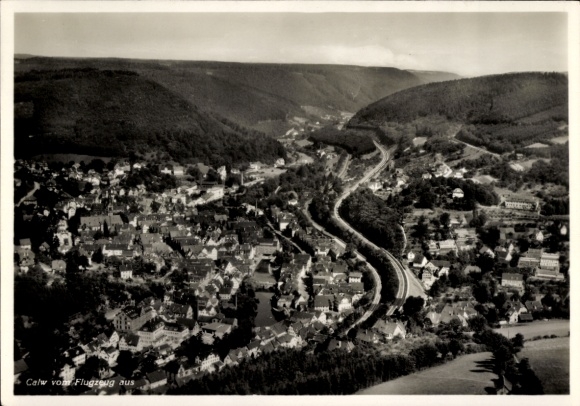 Postcard Calw in the Black Forest, aerial view of the city with mountains in the background