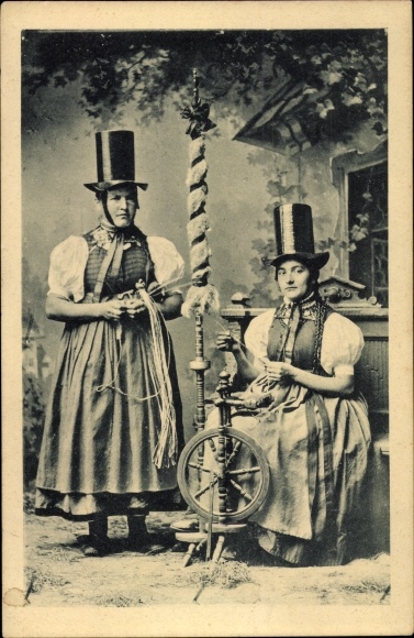 Postcard Wales, Two women in Welsh folk costume, spinning wheel