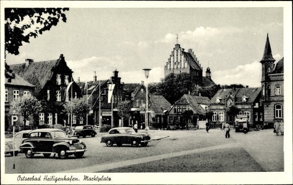 Postcard Baltic resort Heiligenhafen, market place, cars