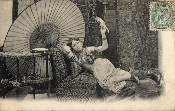Postcard Paris I Louvre, A young woman in an exotic costume poses on a divan.